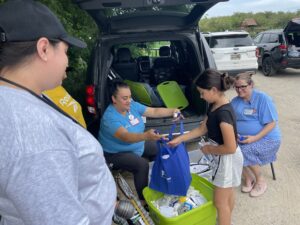 Migrant child receiving donated items